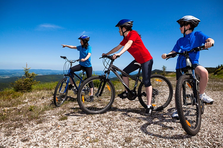 three kids riding kids mountain bikes
