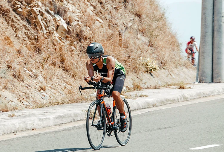 woman racing on a triathlon bike