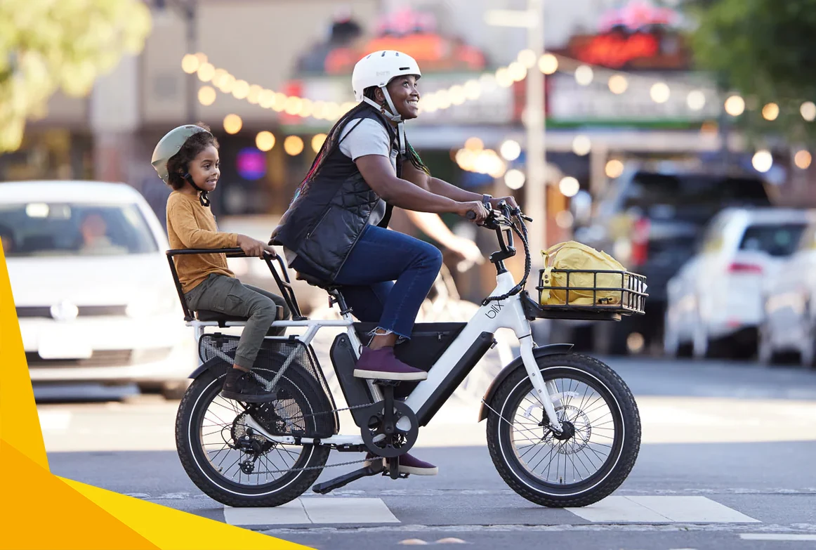 woman riding a blix electric bike and carrying her son on the rear rack