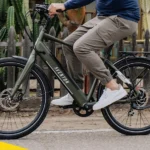 man riding green aventon pace 500.3 ebike