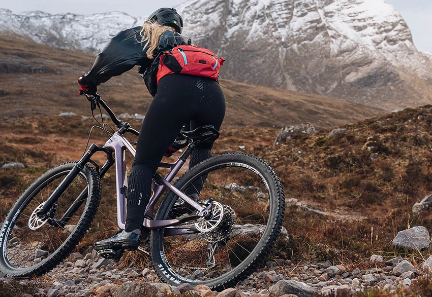 woman riding a mountain bike with 29 inch wheels