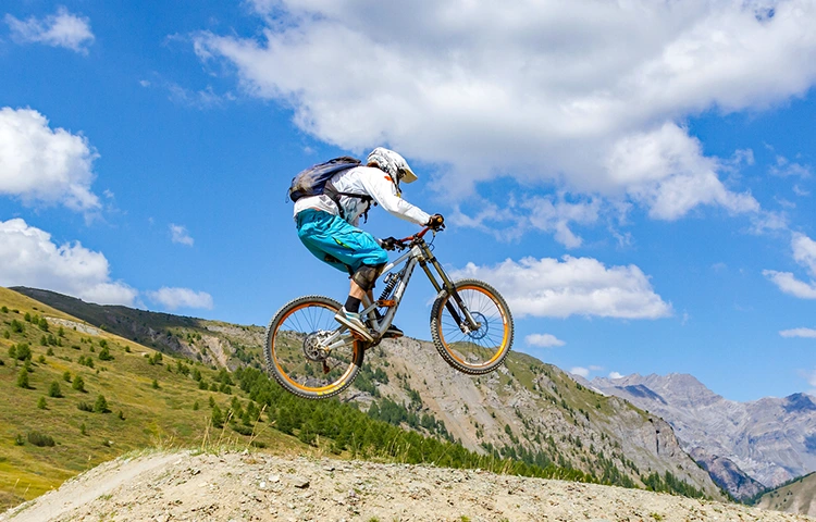 mountain biker doing a jump on a best full suspension mountain bike