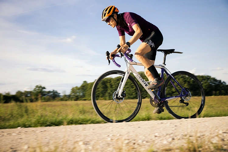 woman riding a white best road bike