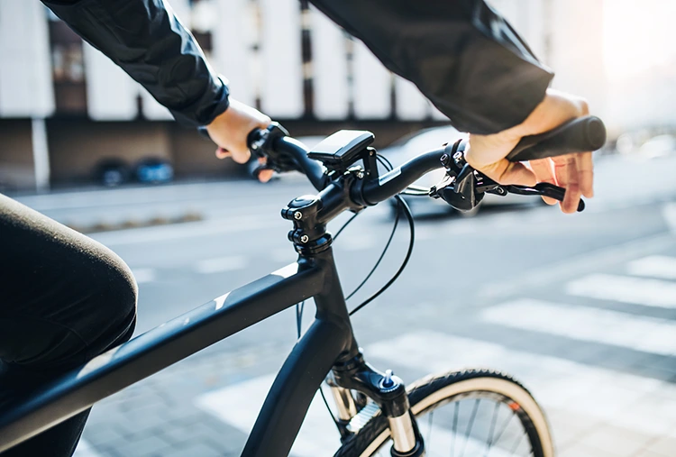 closeup of a man riding a hybrid bike