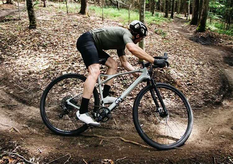 man cornering hard on a gt bicycles gravel bike