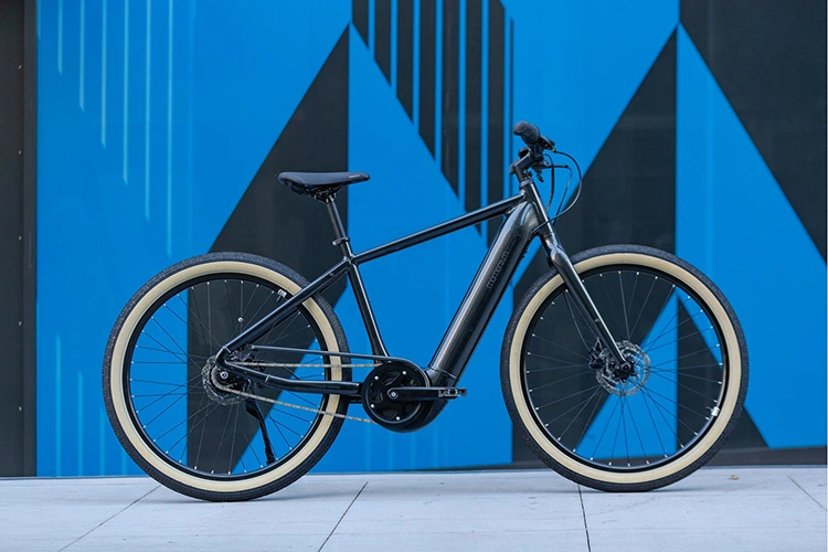 momentum electric bike against a blue background