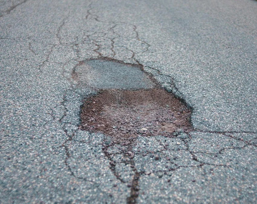 road hazard asphalt pothole